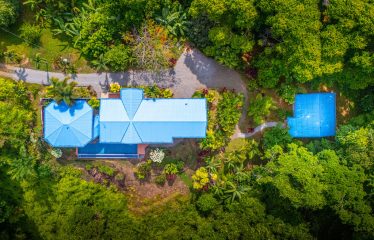 3 BEDROOM HOME WITH PRIVACY, OCEAN AND JUNGLE VIEWS – 5 ACRES
