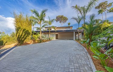 New contemporary tropical villa boasts with a movie theater and views of the iconic whale’s tail