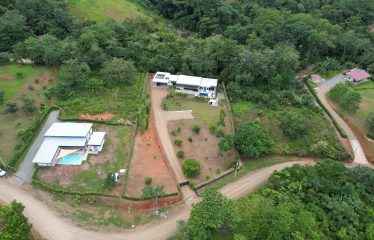 TROPICAL HOME WITH POOL AND SOLAR POWER IN PHASE 11 OF OJOCHAL – 1.41 ACRES